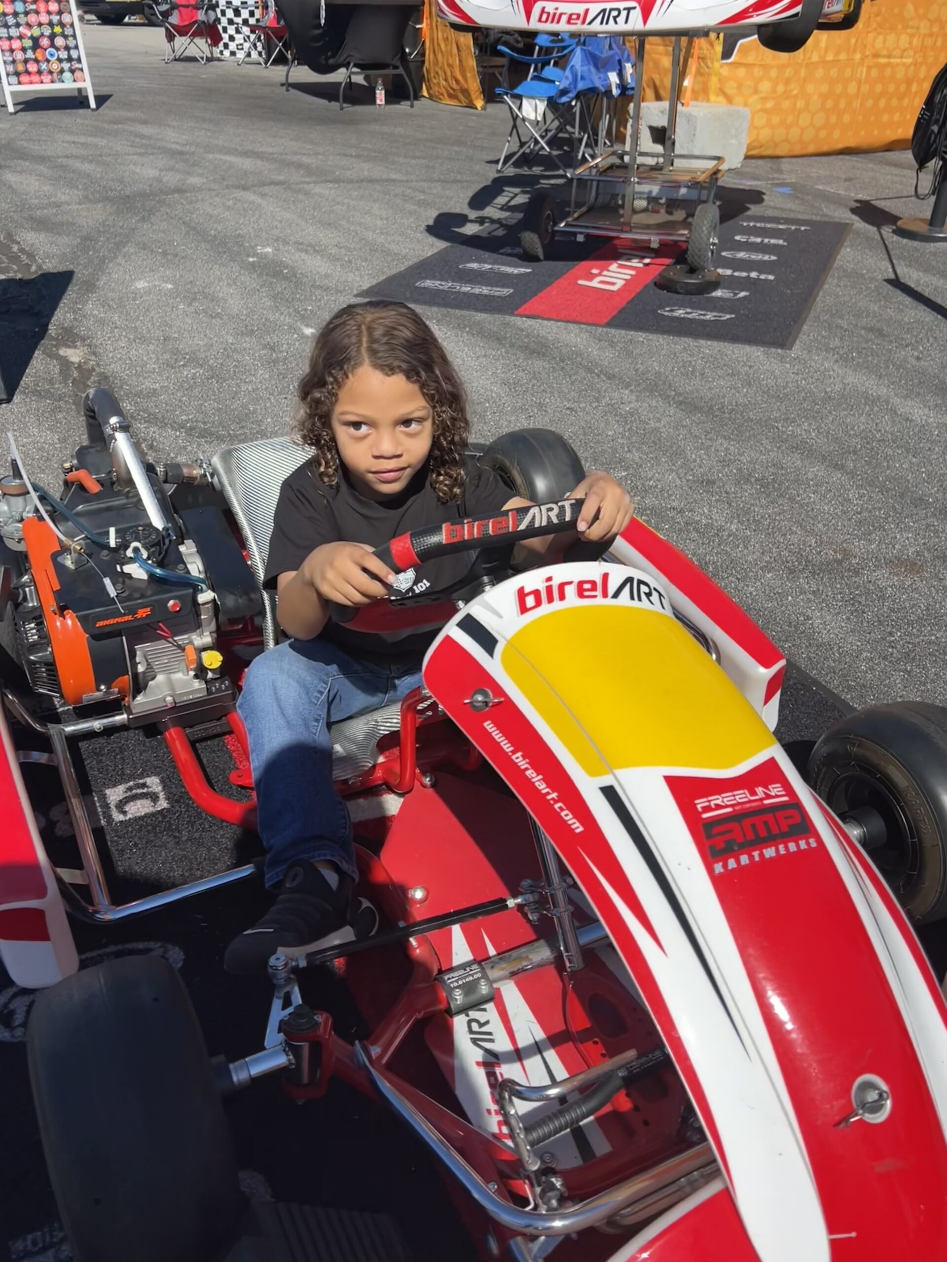 Young participant experiencing motorsports through Speed Safari