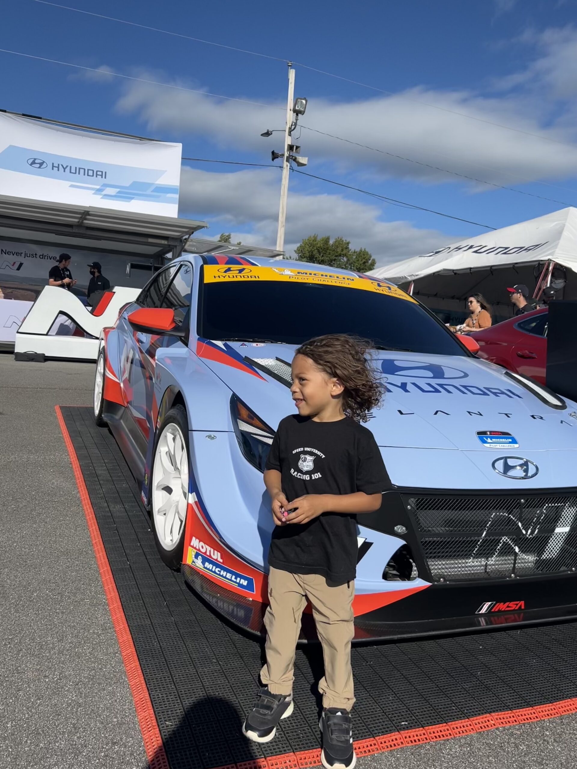 Young participant experiencing motorsports through Speed Safari